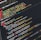 A computer screen displaying code written in PHP and HTML with various lines of syntax highlighted in different colors. The text includes commands, tags, and functions typical for web development.