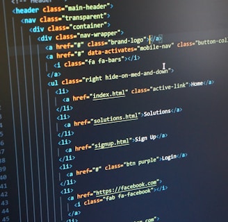 A computer monitor displays HTML code in an integrated development environment. The screen shows a structured hierarchy of HTML tags, including elements such as header, nav, and list items with classes and hyperlinks.